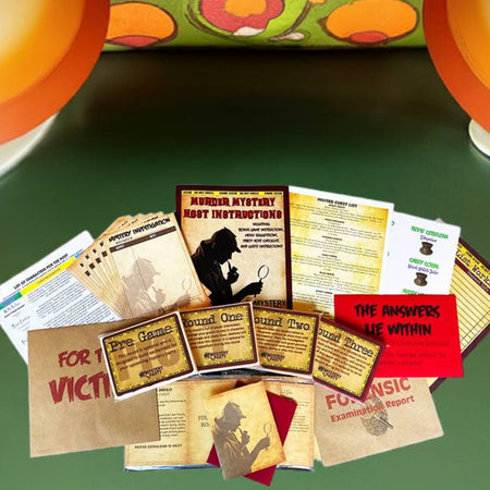 A vintage horror movie memorabilia set displayed on a green surface, featuring a collection of printed cards, tickets, and a small red booklet. The set is styled with retro orange and cream table lamps and a retro floral pillow in the background.
