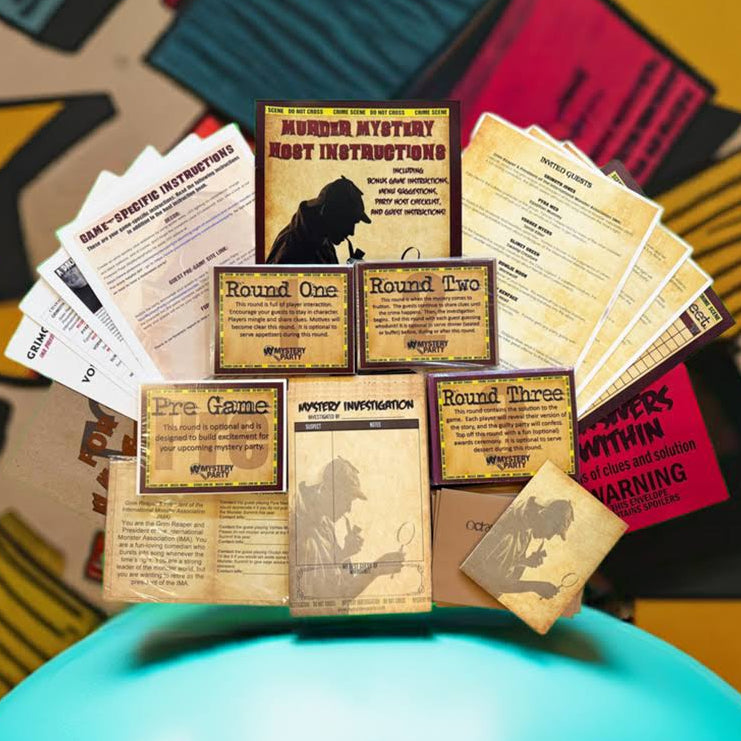 A tabletop display of a mystery game kit with printed instruction sheets, round cards, and small boxes arranged on top of a bright turquoise round tray. The background is a colorful abstract patterned surface.