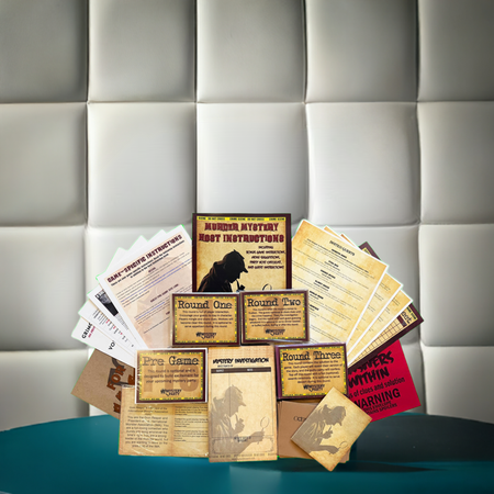 A tabletop display of a mystery game instruction booklet and cards arranged in front of a padded light gray wall. The set includes a main instruction book, several round-robin card boxes, rule cards, and a red warning card on a teal surface.