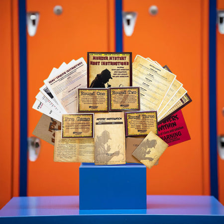 A themed prop display featuring a miniature bouquet of vintage-style documents, manuals, and cards arranged on a blue pedestal in front of orange lockers.